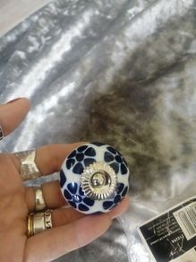 2 blue and white ceramic knobs