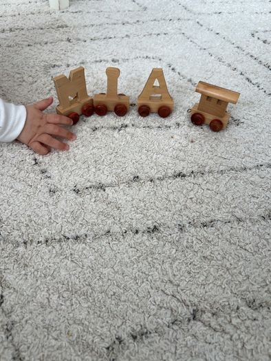 Letters, toys. Name Mia