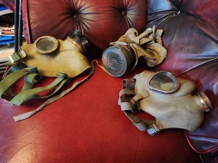 Three gas masks.