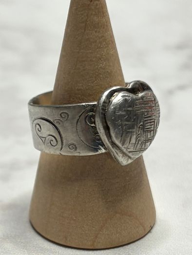 Handmade sterling silver love heart ring with trickles on the wide band. Size R