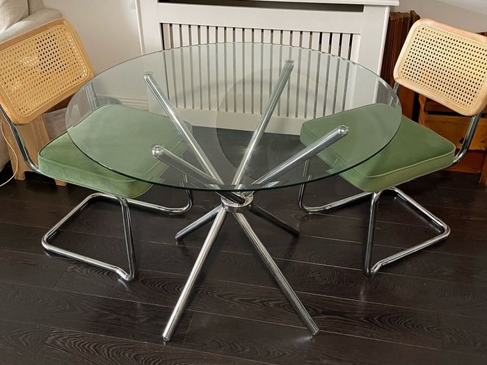 Glass table with two chairs