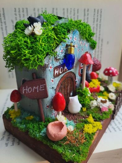 handcrafted fairy cottage with moss roof!
