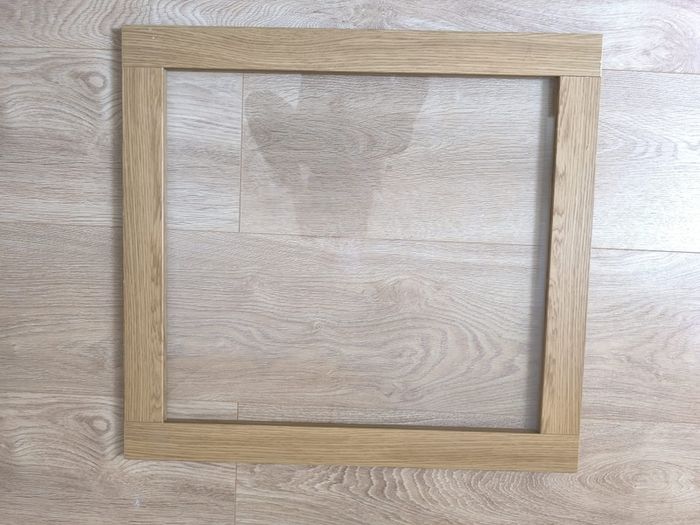 Original IKEA BESTA cabinet door/front panel in discontinued natural oak finish with clear glass centre.
