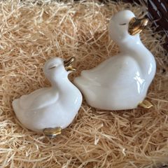 Vintage Pair of porcelain duck figurines.