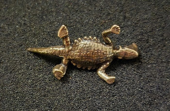 3 brass lizards.