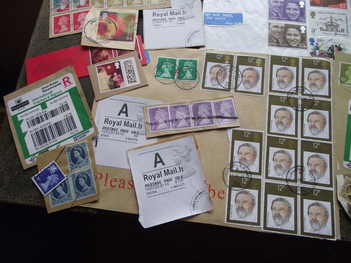 A box with collection of stamps from Great Britain
