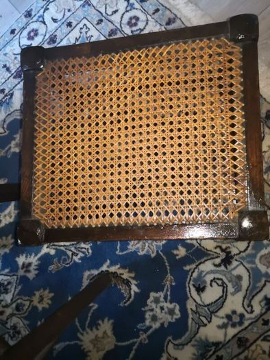Antique solid wood foot rest with cane top