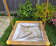 Sand pit with cover.