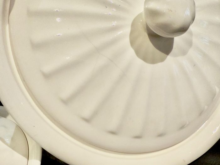 3 white serving bowls with lids.