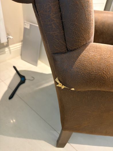 Pair of brown leather chesterfield armchairs