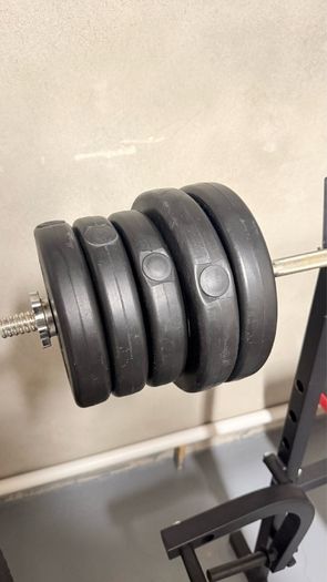 Gym bench, bar and weights.