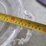 VINTAGE ANTIQUE Molded engraved crystal centerpiece resting on a two handled painted white metal patinated base.  Condition report:  Good condition Image 4