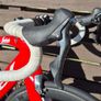 Trek Madone SL6 rim brake in vibrant red. Image 6