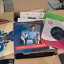 a box of 7" singles. 45 rpm vinyl records. Image 10