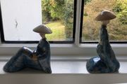 Pair of decorative ceramic figures in blue glaze
