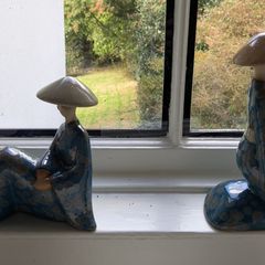 Pair of decorative ceramic figures in blue glaze