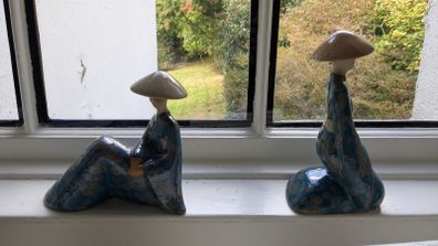 Pair of decorative ceramic figures in blue glaze