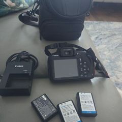 canon 1200d with 3 batteries, ans camera bag