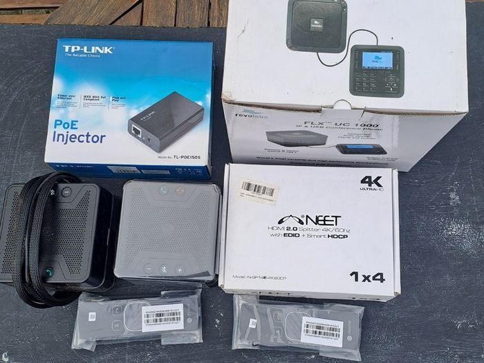 A collection of Conference Phone, Remotes, Splitter