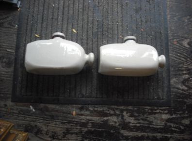 a 2 antique hot water  bottles or foot warmer