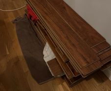 Beautiful Laminate Wood Flooring in dark wood taken up from a room measuring approximately 11 x 7 ft.