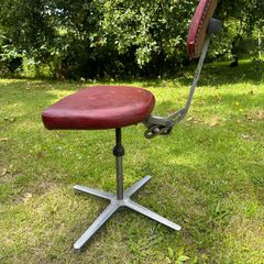 Vintage red swivel and tilt office chair