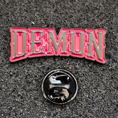 Demon , pin back badge.