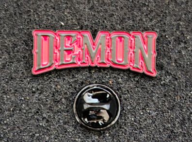 Demon , pin back badge.