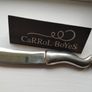 A collectible knife made of polished pewter with a stainless steel blade from Carrol Boyes. Image 7