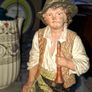 Old Painted Terracotta of a Young Country Boy Holding a Flute, standing on a rocky base. It resembles late 19th- or early 20th-century European decorative sculptures, such as pieces produced by makers like Goldscheider Image 2