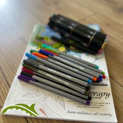 Markers, fineliners and colouring book