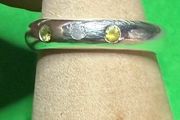 Handmade sterling silver flush set white and yellow stones. Size N