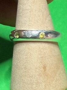 Handmade sterling silver flush set white and yellow stones. Size N