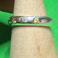 Handmade sterling silver flush set white and yellow stones. Size N