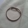 Sculptural sterling silver bangle with three tiny diamond accents. Image 3