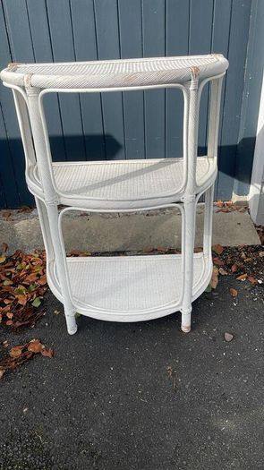 White wicker shelving unit
