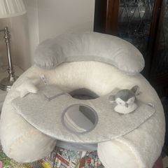 Mamas and Papa's sit and play baby floor seat. https://www.mamasandpapas.ie/products/sit-play-wish-upon-a-cloud-7599wc100