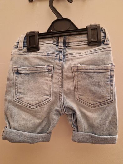 A selection of brand new baby clothes and items