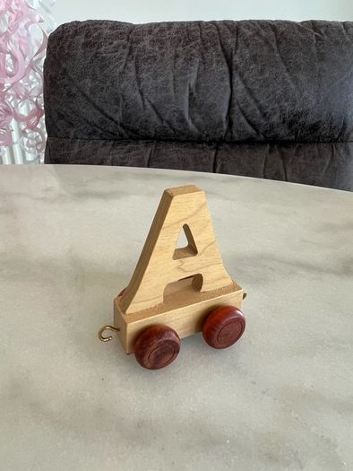 Letters, toys. Name Mia