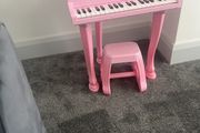 childs pink piano