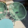 Marks & Spencer Lois garden furniture set in sage green, comprising two armchairs and a matching round table. Image 6