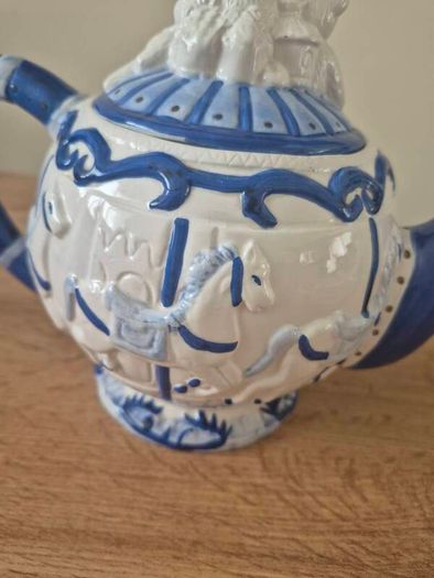 Blue and white ceramic teapot with quartz clock