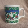 A vintage Christmas mug by Kilncraft (early 1980s) - children at play with snow-sledge design Image 3
