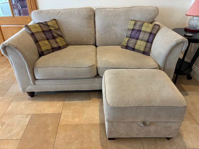 Two-seater sofa with matching storage footstool