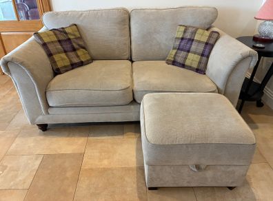 Two-seater sofa with matching storage footstool