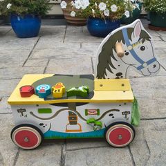 Wooden horse-themed ride-on toy in good used condition