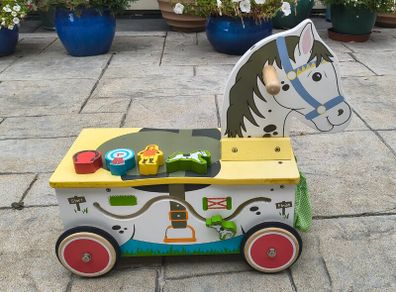Wooden horse-themed ride-on toy in good used condition