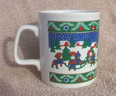 A vintage Christmas mug by Kilncraft (early 1980s) - children at play with snow-sledge design