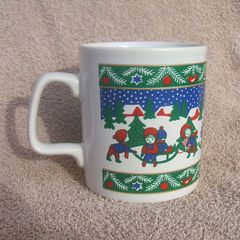 A vintage Christmas mug by Kilncraft (early 1980s) - children at play with snow-sledge design