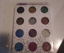12 assorted pots of glitter